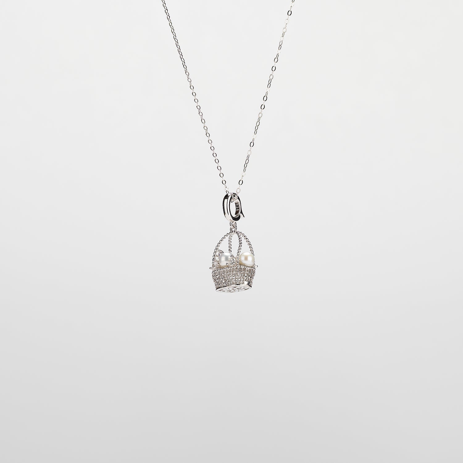 Pearl  pendant necklace on a white background