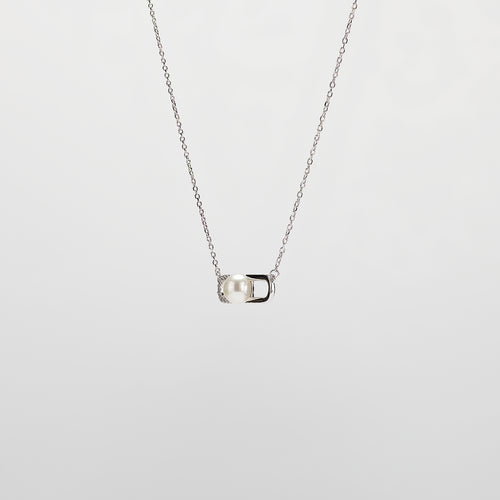 Pearl  pendant necklace on a white background