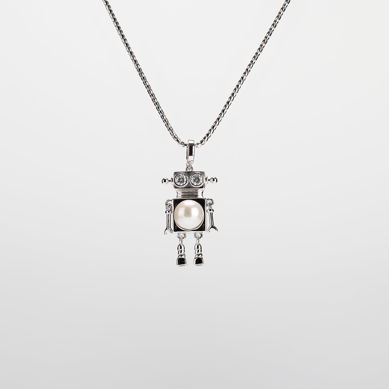 A robot-shaped pearl  pendant necklace on a white background