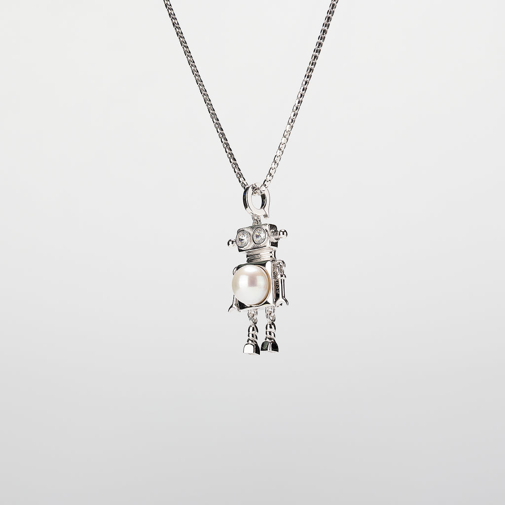 A robot-shaped pearl  pendant necklace on a white background