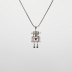 A robot-shaped pearl  pendant necklace on a white background