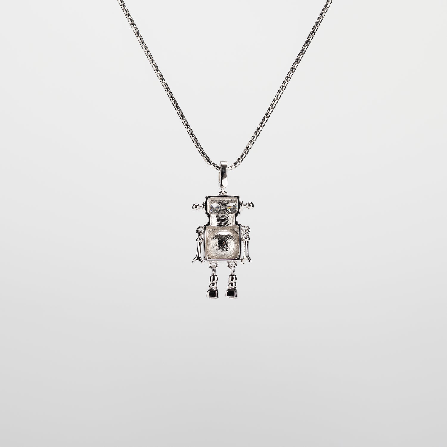A robot-shaped pearl  pendant necklace on a white background