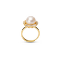 Pearl ring with cubic zirconia on a white background