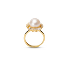Pearl ring with cubic zirconia on a white background